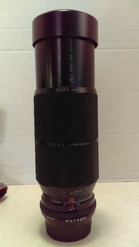 Sigma zoom lens with caps - with,